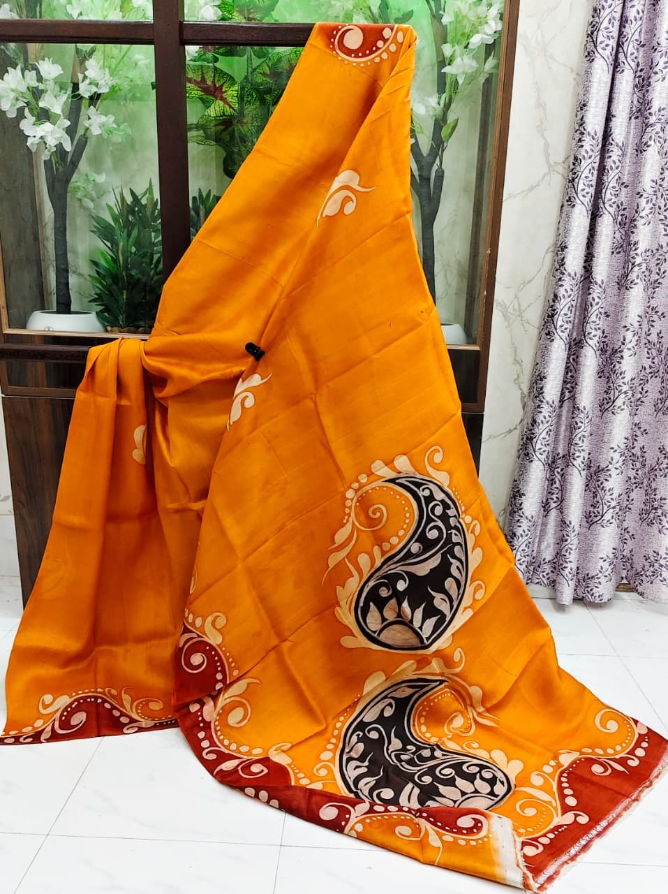 Orange sari with hand-painted paisley motifs